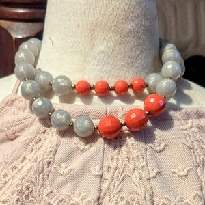 combination of translucent grey beads and opaque orange-red beads necklace